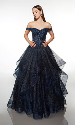 A woman poses against a white background in the Alyce 62173 long formal dress—a midnight, off-the-shoulder prom gown with sparkling details and a layered glitter tulle skirt.