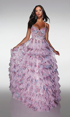 A woman models the Alyce 62182 long prom dress—a light purple floral ball gown with a sheer corset bodice, thin straps, beaded accents, and a layered skirt—posing against a plain light background.