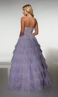 A woman wearing the Alyce 62191 long prom dress, featuring a strapless corset bodice and tiered lavender lace layers, stands facing away from the camera.