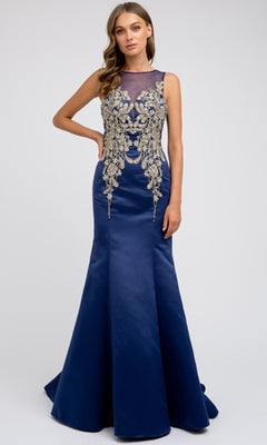 A woman wears the Long Prom Dress: Juliet 623, a floor-length navy blue gown featuring gold floral embroidery on the bodice and a sleeveless, semi-sheer neckline.