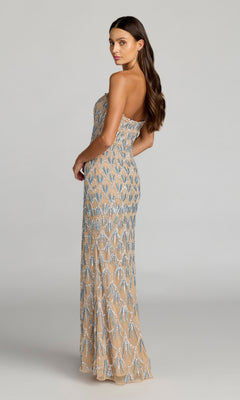 A woman in the Mac Duggal 6250 long formal dress—strapless and floor-length in a nude tone with intricate blue and silver bead detailing—stands sideways against a plain light background; the exquisite hand-beaded design exudes the glamour expected of an evening gown perfect for any elegant occasion.