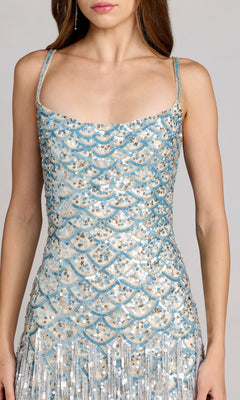 Woman wearing Long Formal Dress: Mac Duggal 6251, a sleeveless fitted style with blue and silver sequin scallop patterns and thin straps, shown from shoulders to mid-thigh.
