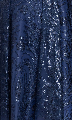 Close-up of the Plus-Size Navy Hoco Dress: Blondie Nites 6266BNW fabric, showcasing intricate swirling floral patterns adorned with glittering sequins and elegant embroidery.