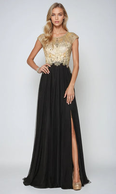 A woman models the Juliet 636 long prom dress, showcasing a gold embellished bodice, sheer back, cap sleeves, A-line skirt with thigh-high slit, and beige heels against a plain background.