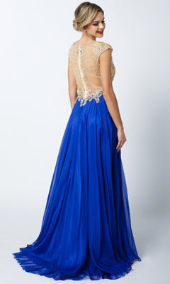 A woman poses against a plain backdrop in the Long Prom Dress: Juliet 636, a floor-length royal blue gown with sheer back, cap sleeves, and an elegant A-line skirt, looking over her shoulder.