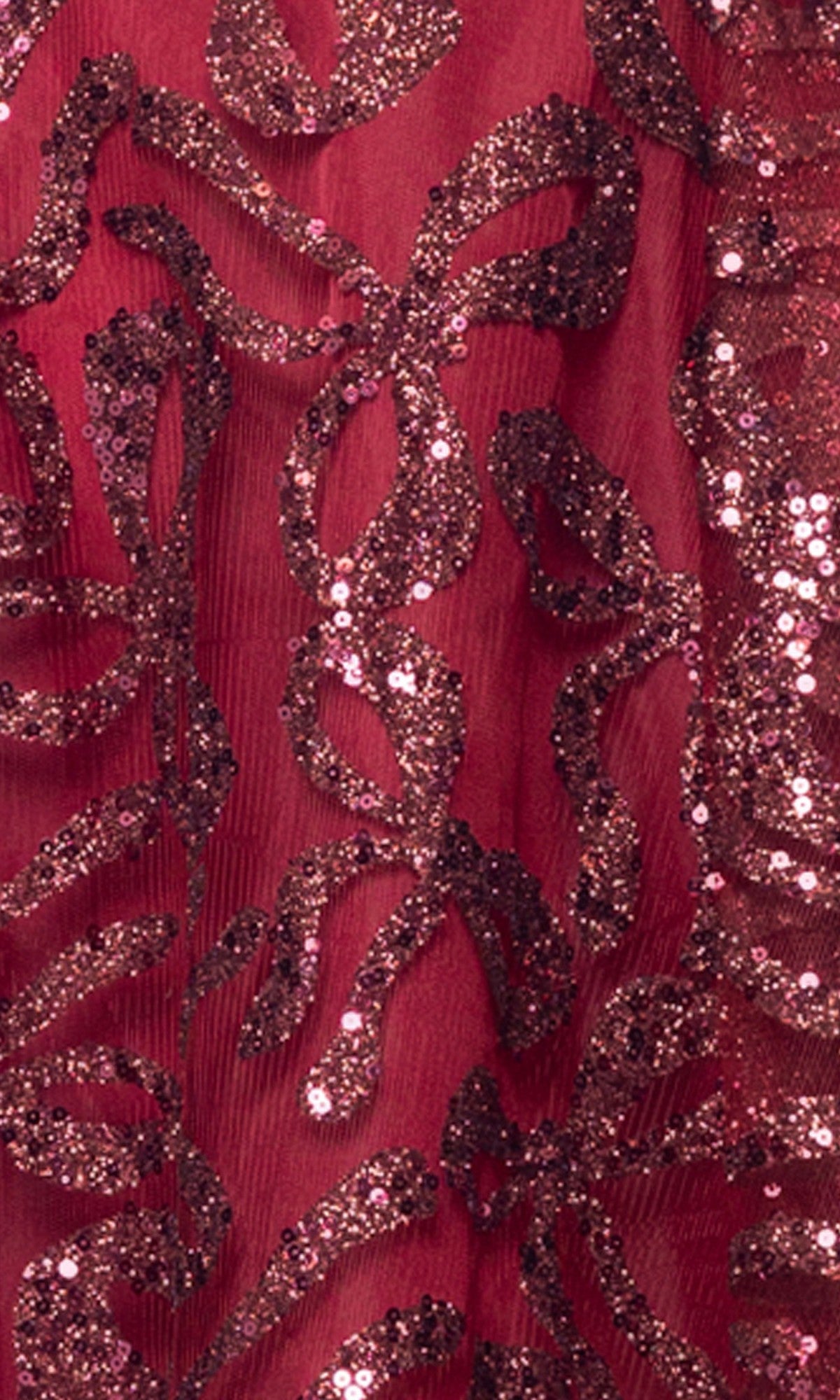 Close-up of the Short Homecoming Dress: Blondie Nites 6416BN, featuring sheer red fabric adorned with a glittery, abstract sequin pattern—perfect for creating a sparkly, eye-catching look for your next mini hoco dress.
