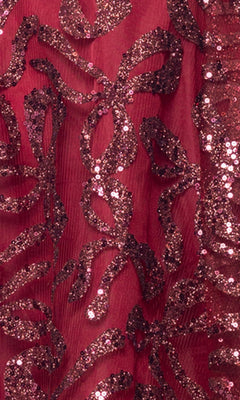 Close-up of the Short Homecoming Dress: Blondie Nites 6416BN, featuring sheer red fabric adorned with a glittery, abstract sequin pattern—perfect for creating a sparkly, eye-catching look for your next mini hoco dress.