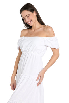 A woman smiles and looks down while wearing the R&M Richards 6669 Tea-Length White Party Dress, set against a plain white background.