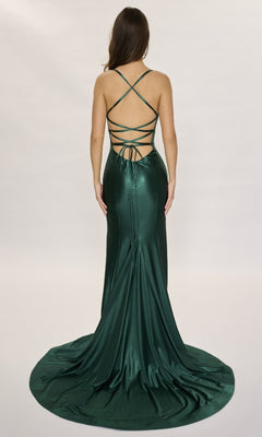 A woman stands facing away against a plain light background, wearing the Nina Canacci 6675— a dark green, floor-length formal dress with crisscross straps and a backless design.
