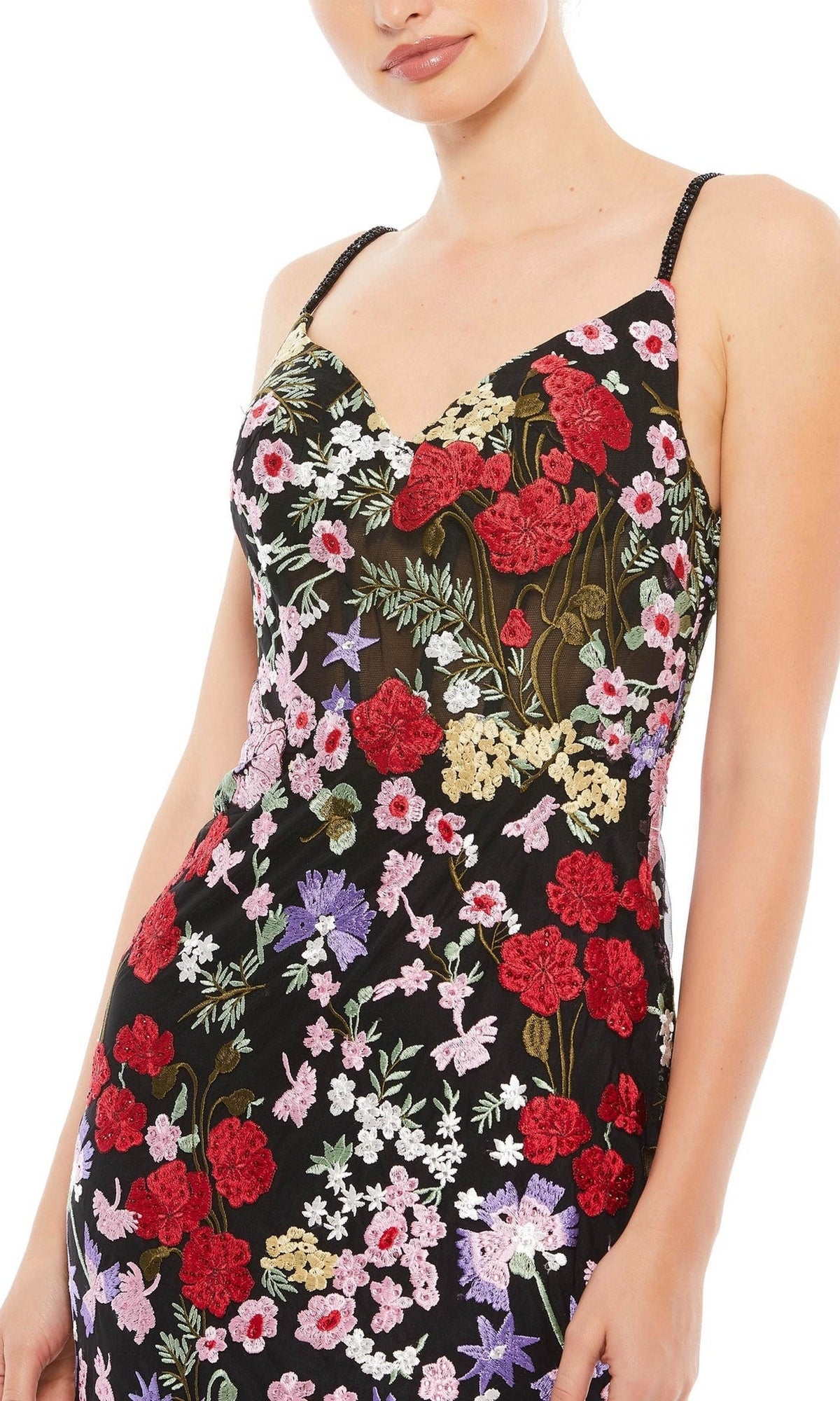 A woman in the Mac Duggal 67473 long floral formal dress, featuring colorful embroidered flowers, creates a stunning look—perfect for prom or special occasions.