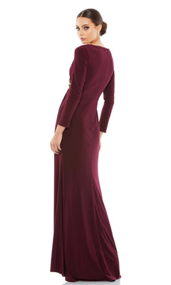 A woman in the Mac Duggal 67848 long sleeve long formal dress stands with her back to the camera, glancing over her shoulder against a plain white background.
