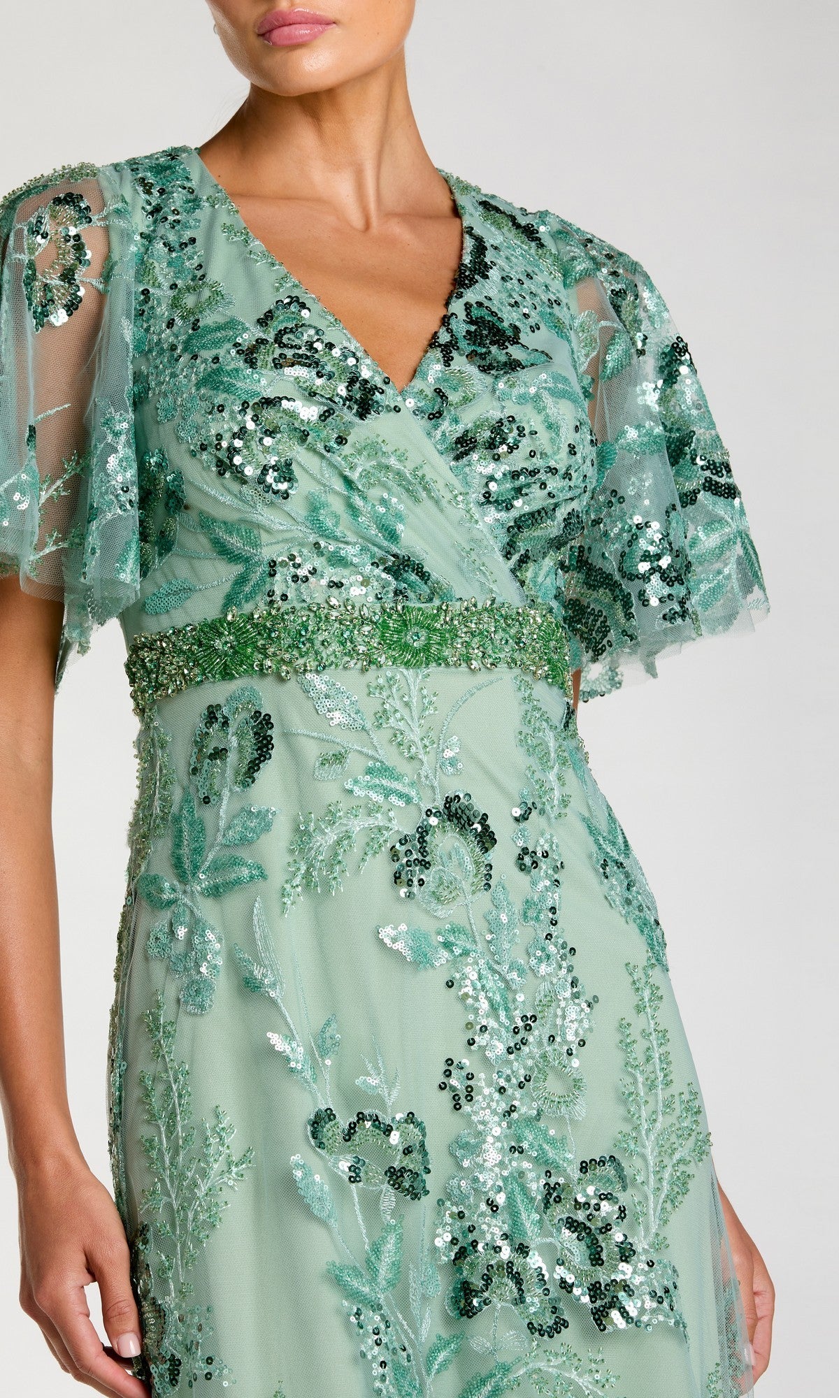 Woman wearing a modest short sleeve pink formal dress—Mac Duggal 67880.