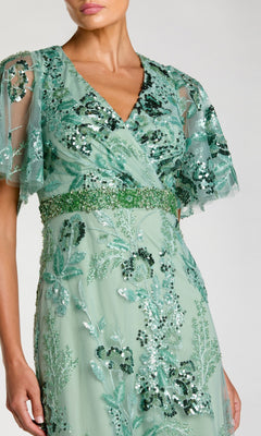 Woman wearing a modest short sleeve pink formal dress—Mac Duggal 67880.