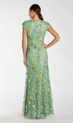 A woman stands with her hand on her hip, wearing a Mac Duggal 67882 cap sleeve long blue formal gown, viewed from the back.
