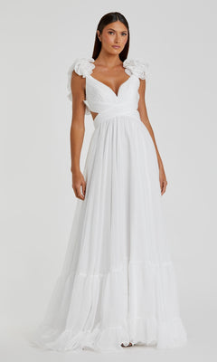 A woman wears the Mac Duggal Empire-Waist Cut-Out Formal Dress 67911—a long white gown with ruffled shoulders, deep V-neckline, and side cut-outs—standing against a plain background.