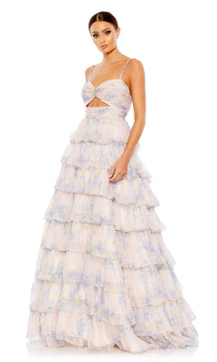 A woman wears the Violet Print Prom Ball Gown by Mac Duggal (67966), featuring pastel florals, spaghetti straps, a midriff cutout, and a ruffled tier skirt, standing against a white background.