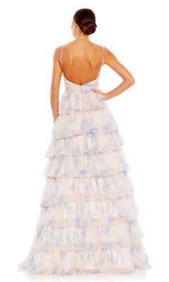A woman faces away from the camera in the Mac Duggal 67966 Violet Print Prom Ball Gown—a sleeveless, floor-length dress with thin straps, a formal a-line silhouette, an open back, and a ruffled tiered skirt.