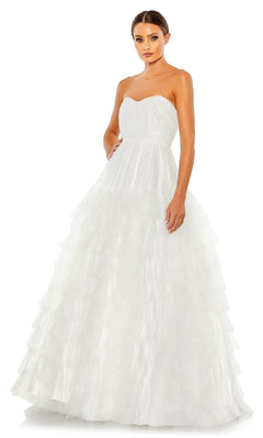 A woman stands facing forward against a white background in the Long Formal Dress 67999 by Mac Duggal, featuring a strapless bodice, empire waist, and layered tulle skirt.