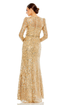 A woman, seen from the back with her hair in a low bun, wears the Long Beaded-Lace Formal Dress: Mac Duggal 68011—an elegant long gold gown with beaded lace, long sleeves, and a fitted waist, ideal for the mother of the bride.