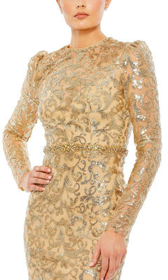 A person poses with one hand on hip in the Mac Duggal 68011 Long Beaded-Lace Formal Dress, a gold and silver sequin embroidered, long-sleeve gown with intricate patterns—an elegant choice for a mother of the bride.