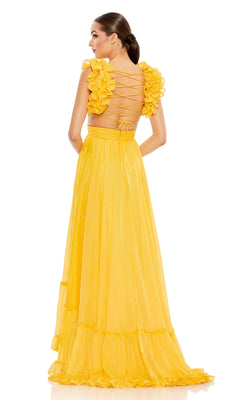 Woman in a yellow Lace-Up Ruffled Formal Gown: Mac Duggal 68094, featuring an open back, ruffled sleeves, and a floor-length skirt, stands facing away from the camera.