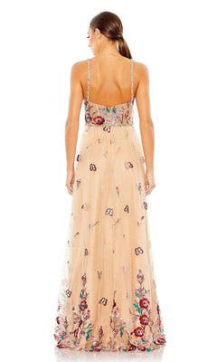A woman with a low ponytail is seen from behind wearing the Mac Duggal Embroidered Nude Formal Dress 681101, a long sleeveless gown featuring floral sequin embroidery and thin straps.
