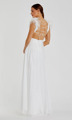A woman stands against a plain background wearing the Mac Duggal 68113 Feather-Trim Long Formal Dress, featuring strappy open back, feathered shoulder details, and a floor-length white skirt.