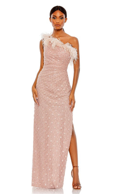 A woman stands confidently in the Feather One-Shoulder Formal Gown by Mac Duggal (68139), featuring blush pink fabric, a feather-trimmed neckline, and a thigh-high slit—capturing timeless elegance.