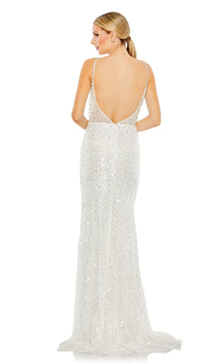 A woman in the Long Formal Dress 68175 by Mac Duggal—a floor-length, white sequin mermaid gown with thin straps and a low back—faces away from the camera.