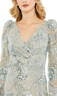 Woman wearing the Mac Duggal 68190 Long Sleeve Beaded Formal Dress, featuring a light blue floral lace design, V-neckline, and intricate embroidery with beaded detailing.