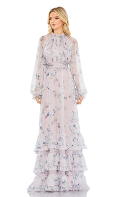 A woman wears the Long Formal Dress 68199 by Mac Duggal, featuring a lilac floral print, sheer long sleeves, tiered ruffle skirt layers, and an elegant A-line silhouette with a high neckline.