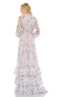 A woman faces away from the camera wearing the Long Formal Dress 68199 by Mac Duggal, a lilac floral gown with sheer sleeves and tiered ruffle details.