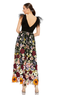Woman wears the Mac Duggal 68204 tea-length floral formal dress with ruffled tulle sleeves, standing with her back to the camera and her hair in a ponytail.