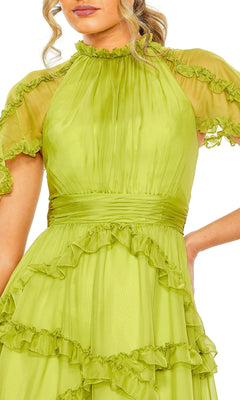 A woman wearing the Long Formal Dress 68222 by Mac Duggal, featuring apple green ruffles, an A-line silhouette, puffed short sleeves, a high neckline, and pleated details at the waist and bodice.