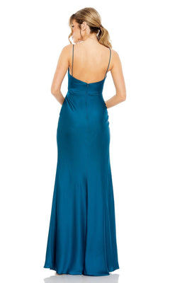 Woman with a ponytail wears the Mac Duggal 68347 Cut-Out Long Formal Dress—a floor-length teal satin gown with thin straps, twist-front bodice, and backless design—standing and facing away from the camera.
