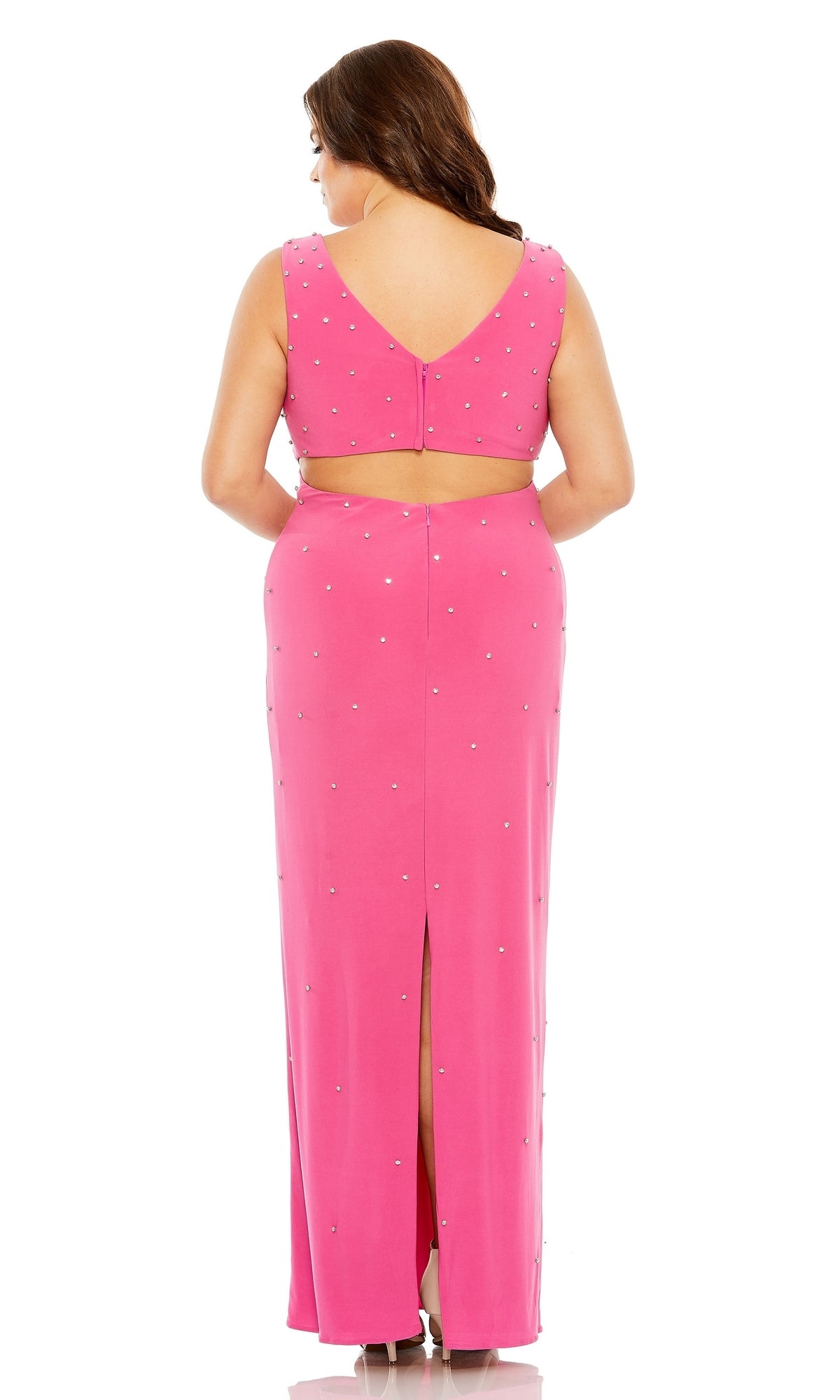 A woman is shown from the back wearing the Long Plus-Size Formal Dress 68353 by Mac Duggal, a sleeveless hot pink gown with a V-back, subtle embellishments, and a back slit.