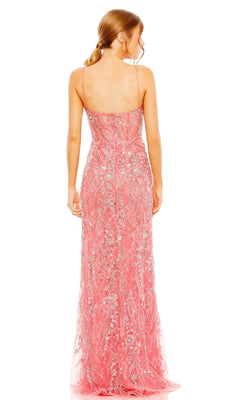 A woman with light brown hair in a low ponytail is shown from the back wearing the Long Formal Dress 68511 by Mac Duggal, a floor-length coral pink gown with silver sequin embellishments.