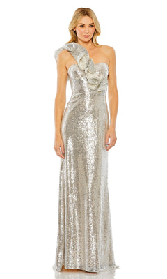 A woman models the Mac Duggal 68513 Long Sequin Formal Dress, a floor-length gown with silver sequins and an asymmetrical ruffled one-shoulder design, standing before a plain white backdrop.