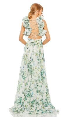 Woman in the Long Formal Dress 68521 by Mac Duggal—a flowing green A-line dress featuring floral details, ruffles, and an open lace-up back—standing and facing away.