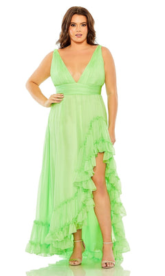 A woman models the Long Plus-Size Formal Dress 68541 by Mac Duggal—a sleeveless, light green gown with a deep V-neckline, ruffle hem slit, and elegant ruffled trim—posed gracefully against a plain white background.