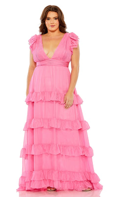 A woman faces forward in the Long Plus-Size Formal Dress 68544 by Mac Duggal, a floor-length pink ruffle gown with short flutter sleeves and a deep V-neckline—an elegant A-line choice for special occasions.
