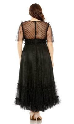 A woman wears the Long Plus-Size Prom Dress 68568 by Mac Duggal, featuring a high neck and sheer polka-dot sleeves and back, standing with her back to the camera against a white background.