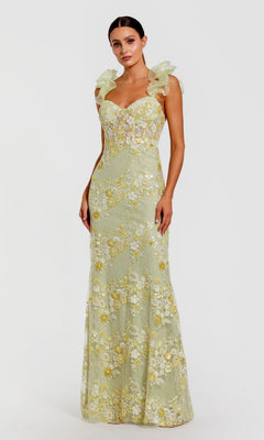 A woman models the Mac Duggal 68880 Long Formal Dress, a light yellow, floor-length gown with floral embroidery, a sweetheart neckline, and sheer ruffled shoulder straps, standing against a plain white background.