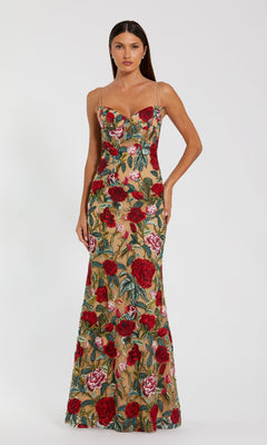 A woman models the Mac Duggal 68884 Long Floral-Lace Formal Dress, a floor-length gown with thin straps and vibrant floral lace over a nude base, set against a plain white background.