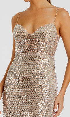 A woman models the Mac Duggal 68895 Long Formal Dress—a fitted, sleeveless evening gown adorned with silver sequins—shown from shoulders to thigh against a plain background.