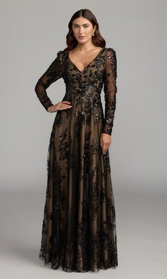 A woman stands against a plain gray background wearing the Mac Duggal 68908, a sophisticated long sleeve formal dress in black nude, featuring sheer fabric and sequin floral embellishments—ideal as an embroidered gown for the mother of the bride or any elegant occasion.