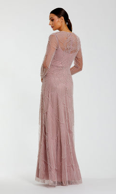 Wearing the Mac Duggal 69012, a woman stands with her back to the camera, highlighting the exquisite pearl beading and intricate detailing on the back and sleeves of this long, blush-colored formal dress against a simple background.