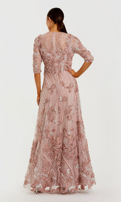 Woman wearing a floral evening gown with a white background