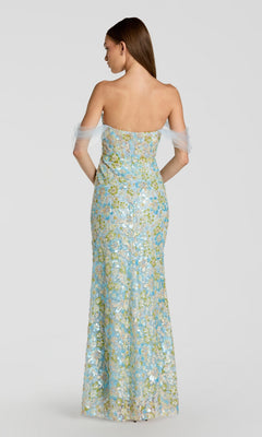 A woman is shown from the back against a plain light background, wearing the Long Formal Dress: Mac Duggal 69045—a strapless, floor-length gown featuring blue floral embroidery and sheer off-the-shoulder sleeves.