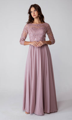 A woman stands against a plain, light background wearing the Eureka 6909 Long-Sleeve Long Formal Dress—an elegant mauve A-line gown featuring a lace bodice and long sleeves.